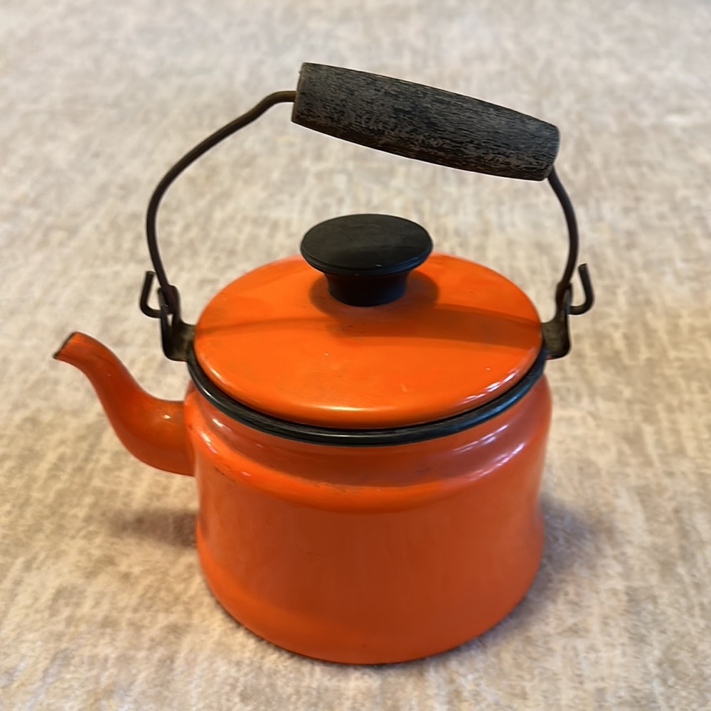Vintage orange enamel teapot with wooden handle